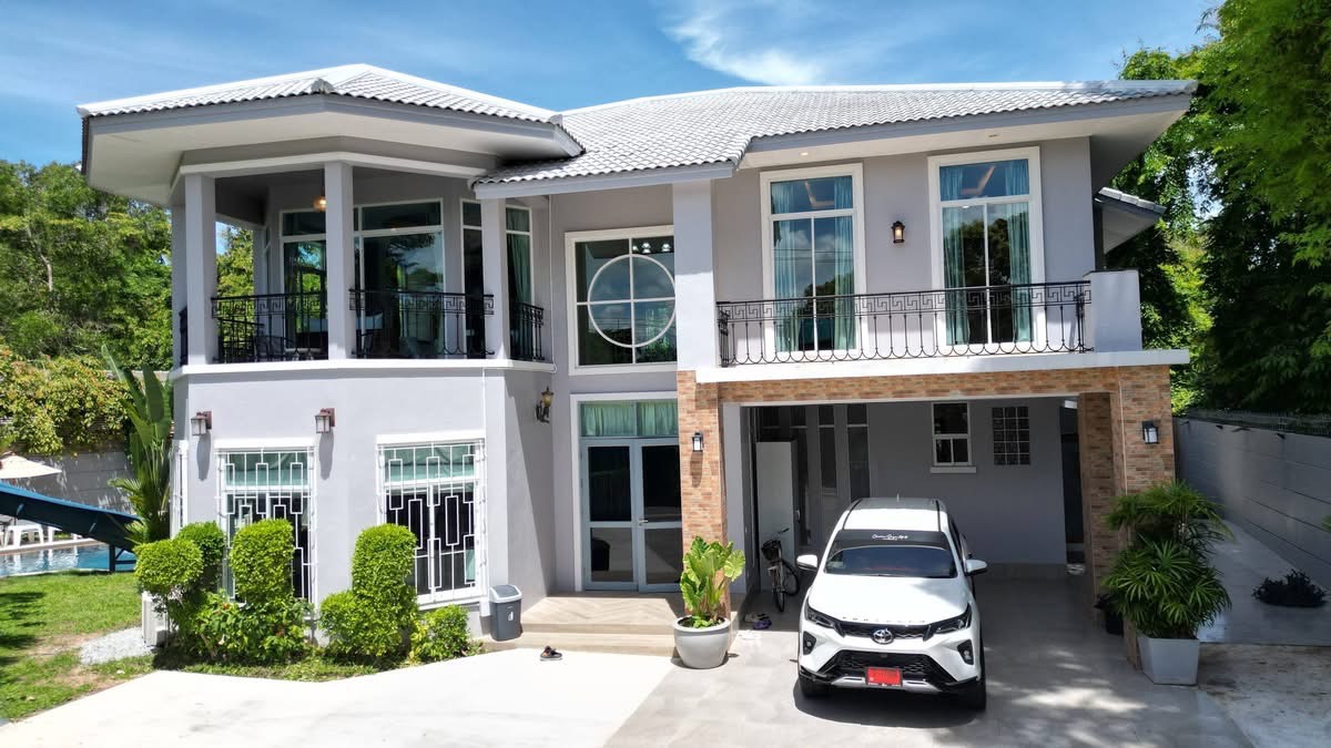 My Memory Pool Villa exterior front view with lush tropical garden